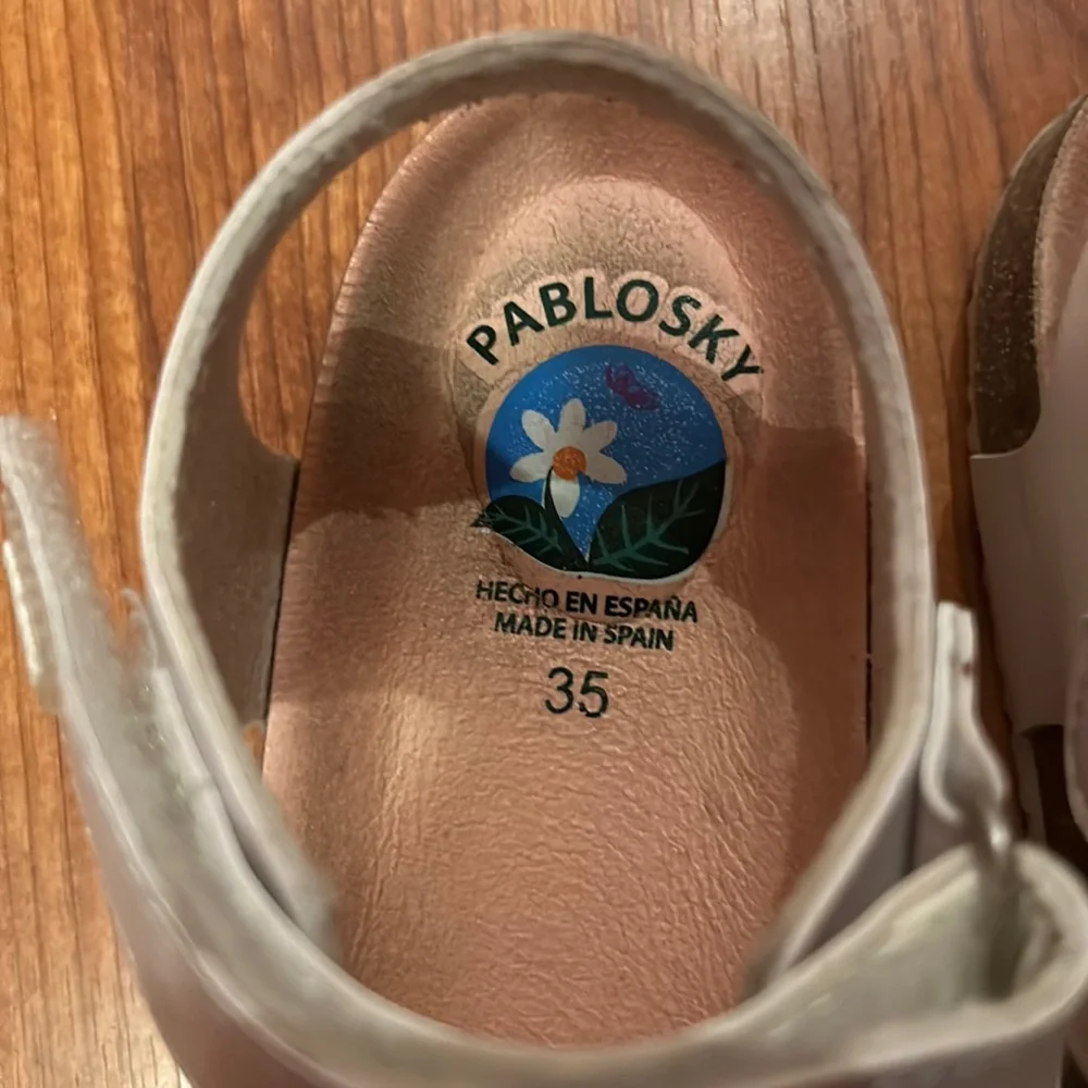 Pablosky girls sandals with silver flowers on the top. Size 5